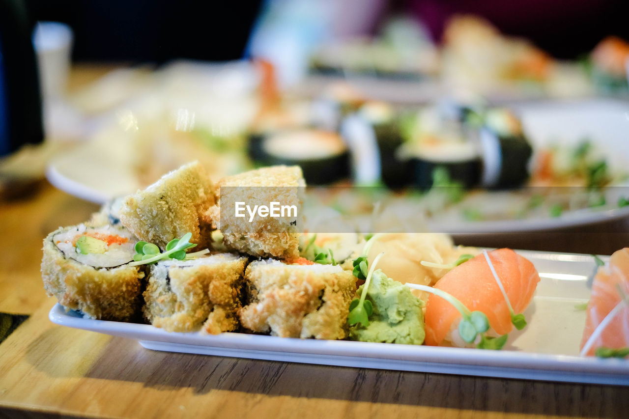 CLOSE-UP OF SUSHI SERVED IN PLATE