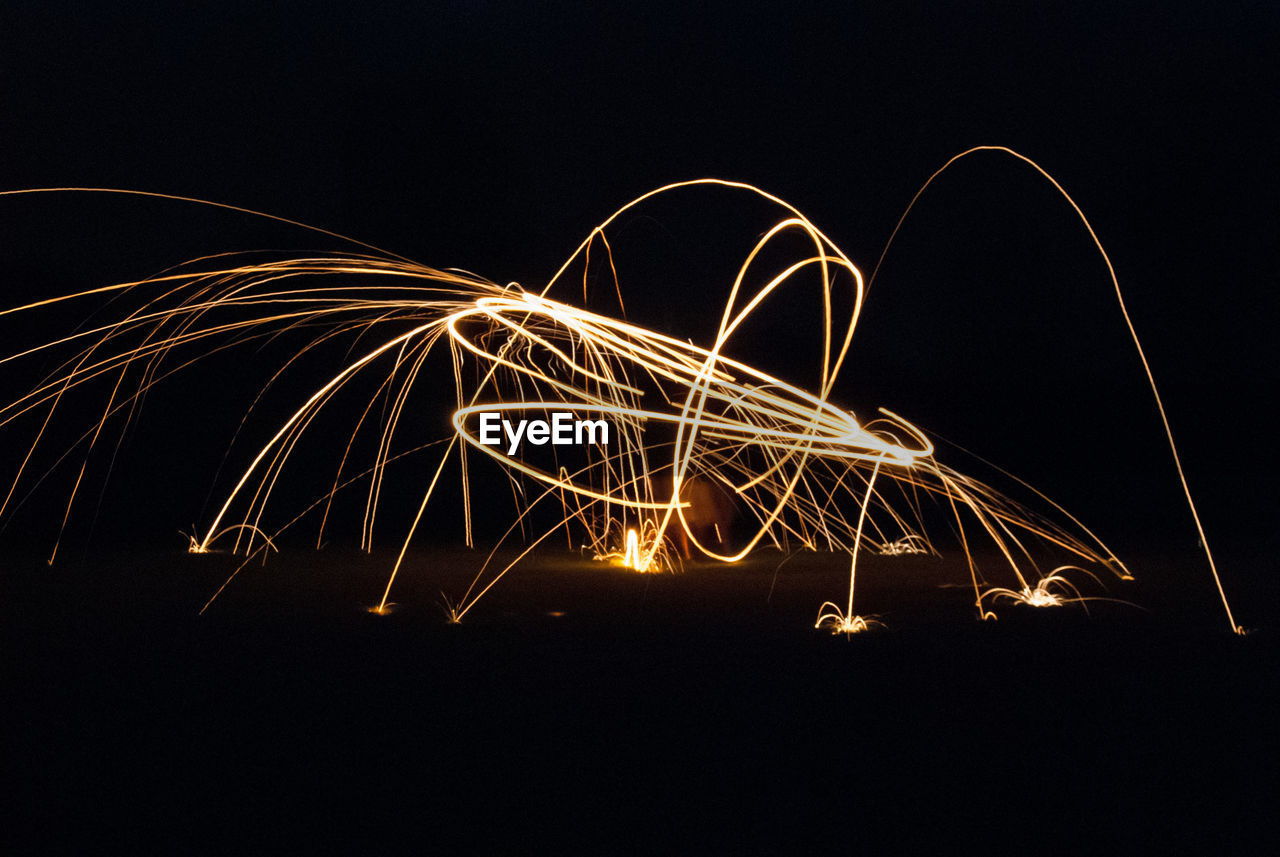 Light trails against sky at night