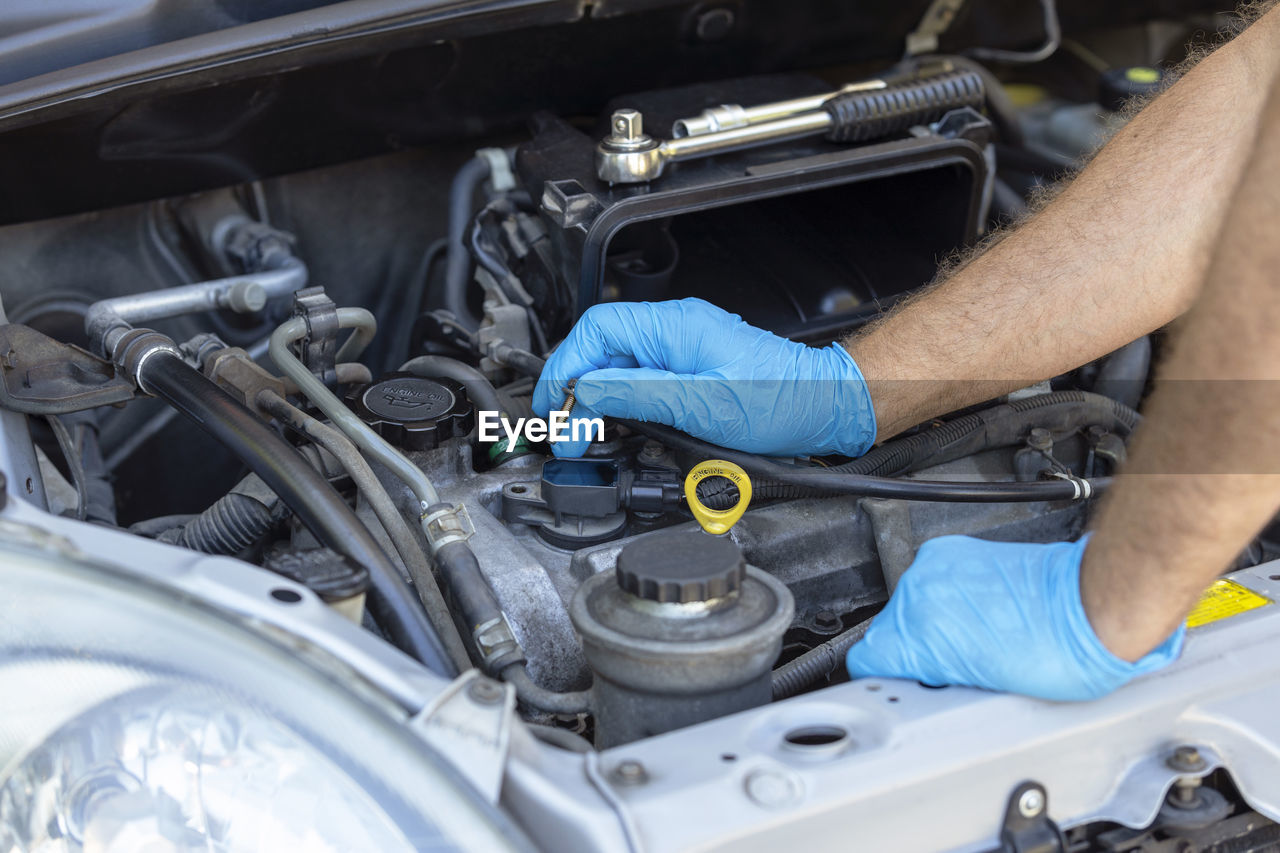 Ignition coil or car spark plug change or replacement. repairing of vehicle engine.