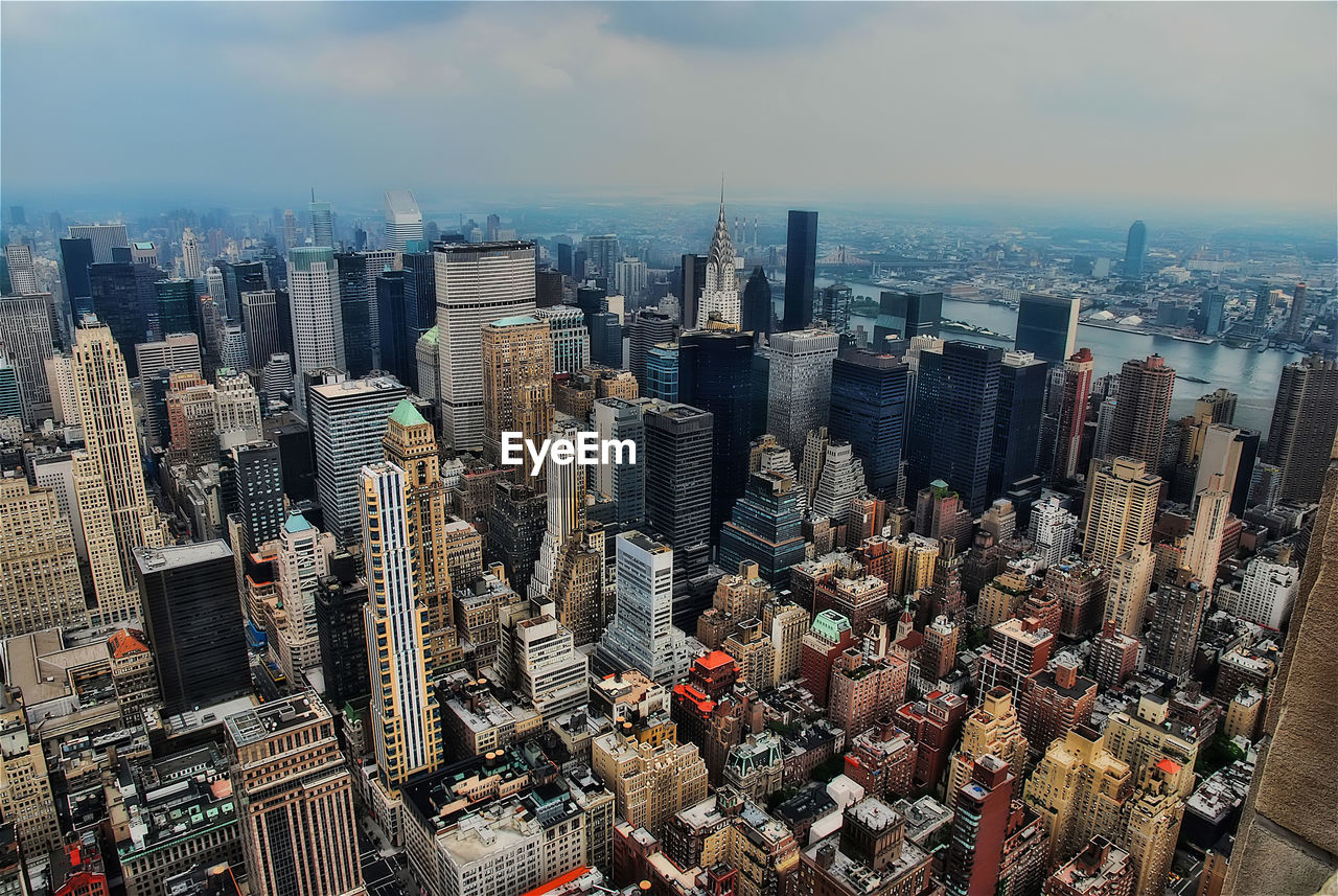 High angle view of modern buildings in city against sky