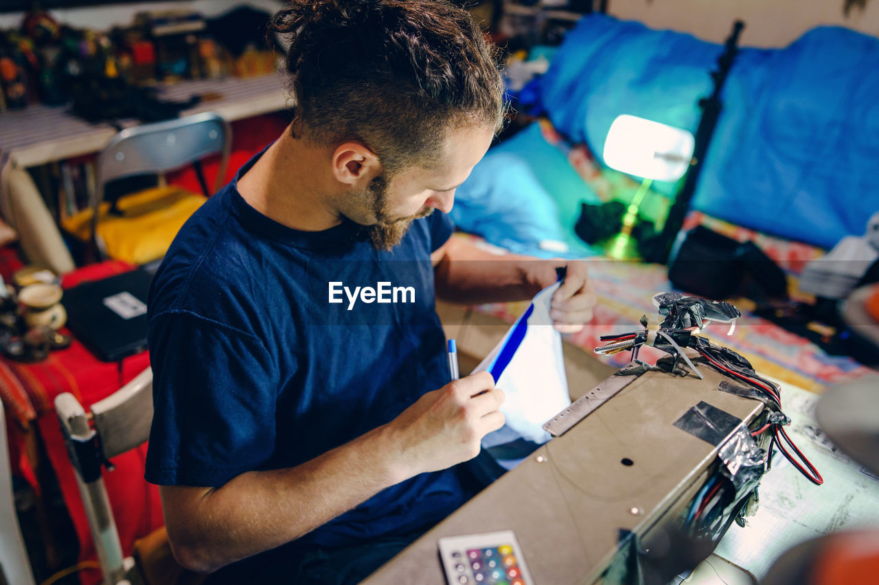 Man working on sewing machine