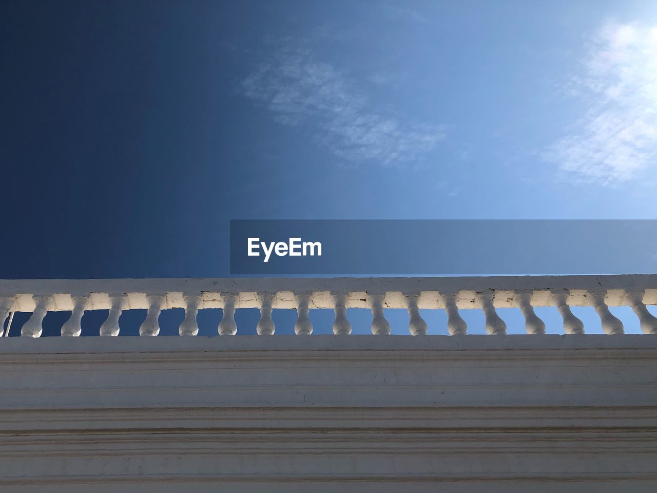 LOW ANGLE VIEW OF CONCRETE WALL AGAINST SKY