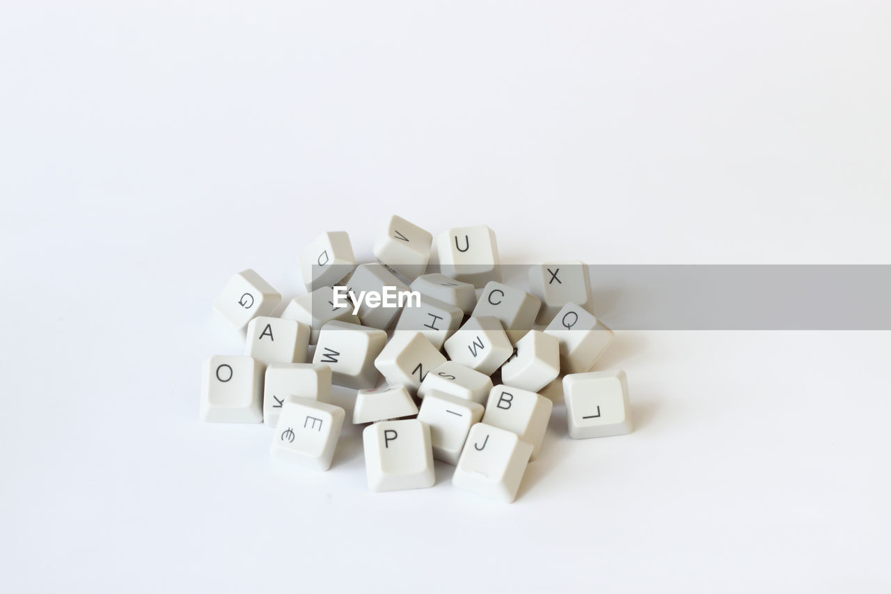 High angle view of computer keyboard against white background