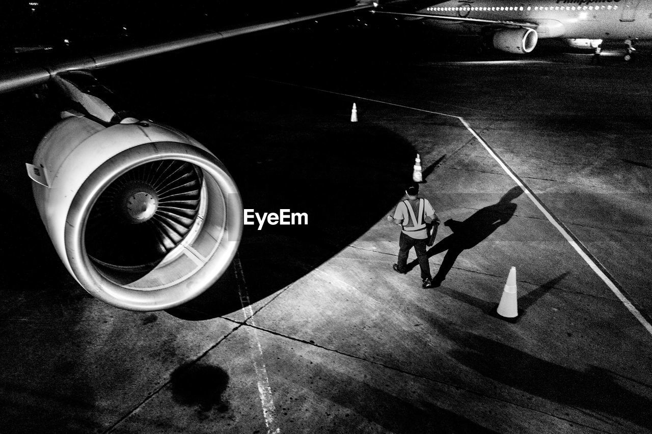 High angle view of man working at airport runway