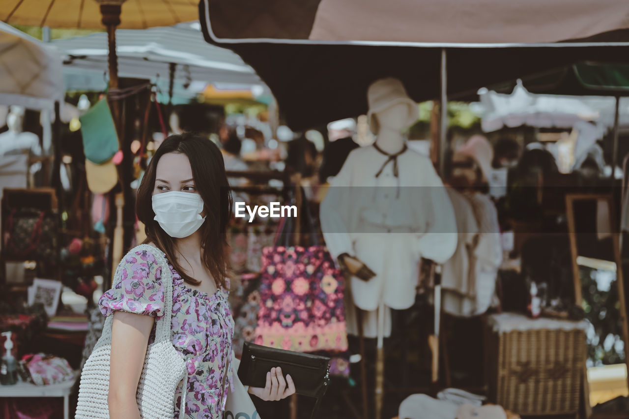 Series photo of young woman travel and shopping in street market , chiang mai north of thailand