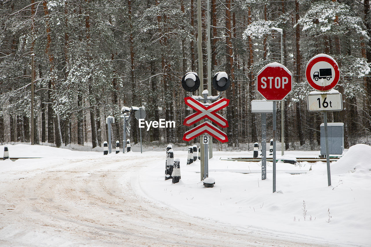 Railway crossing on a snowy winter day