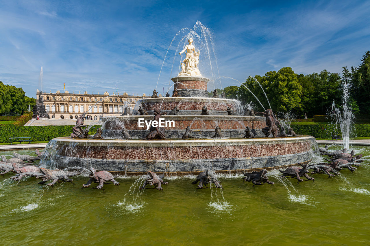 Fountain of latona against cloudy sky