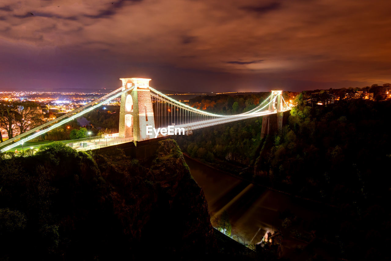 Illuminated suspension bridge at night