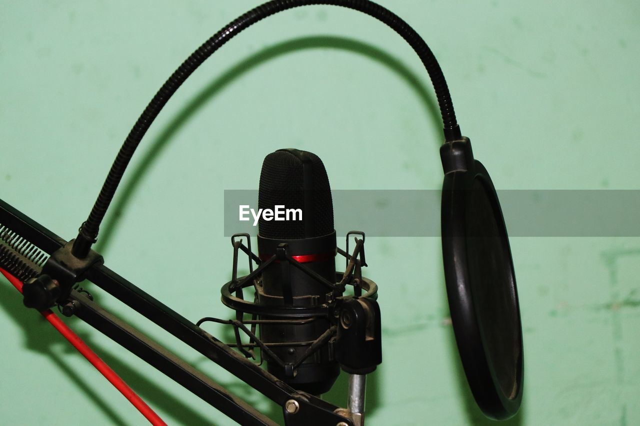 CLOSE-UP OF ELECTRIC FAN ON CABLE