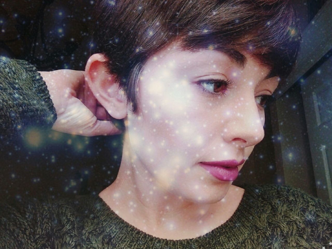 Digital composite image of woman and star field