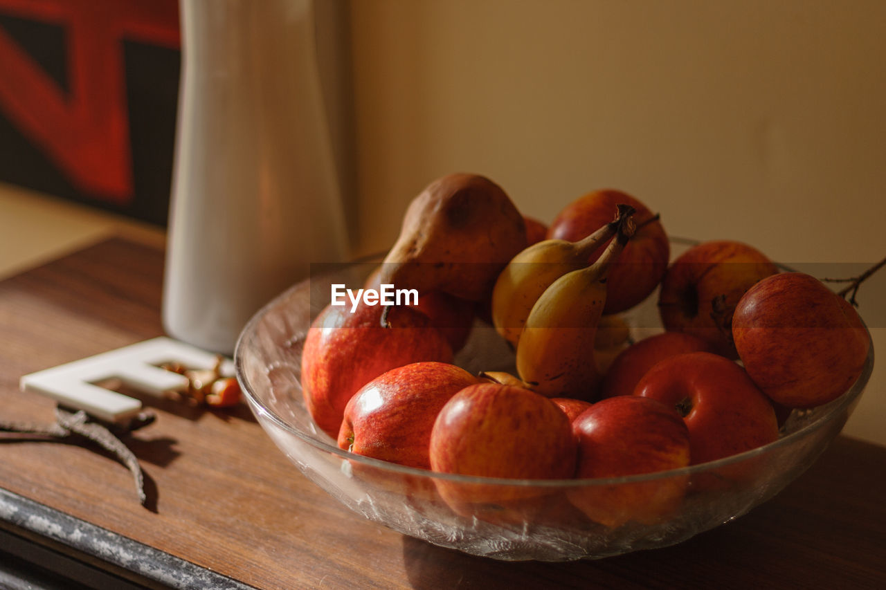 CLOSE-UP OF FRUITS ON TABLE