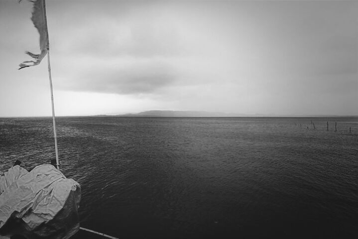 VIEW OF SEA AGAINST CLOUDY SKY