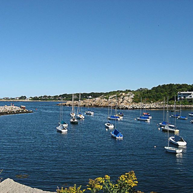 BOATS IN SEA WITH BOATS IN BACKGROUND