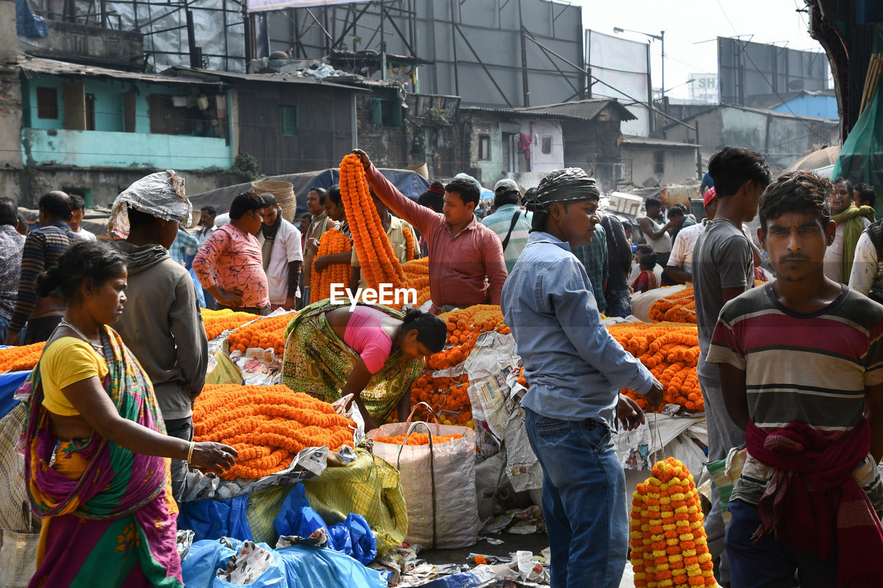 GROUP OF PEOPLE IN MARKET