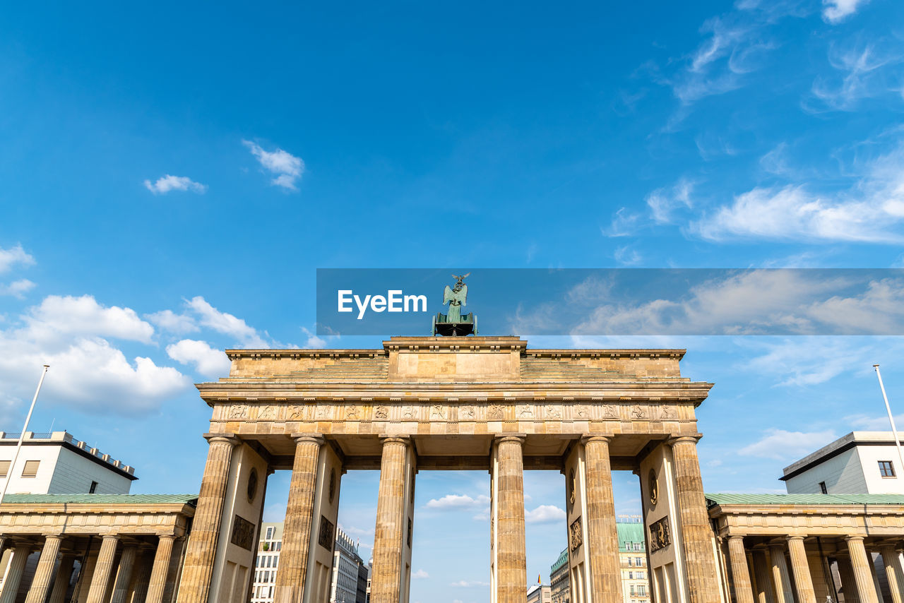 Low angle view of the brandenburg gate in berlin at evening, germany