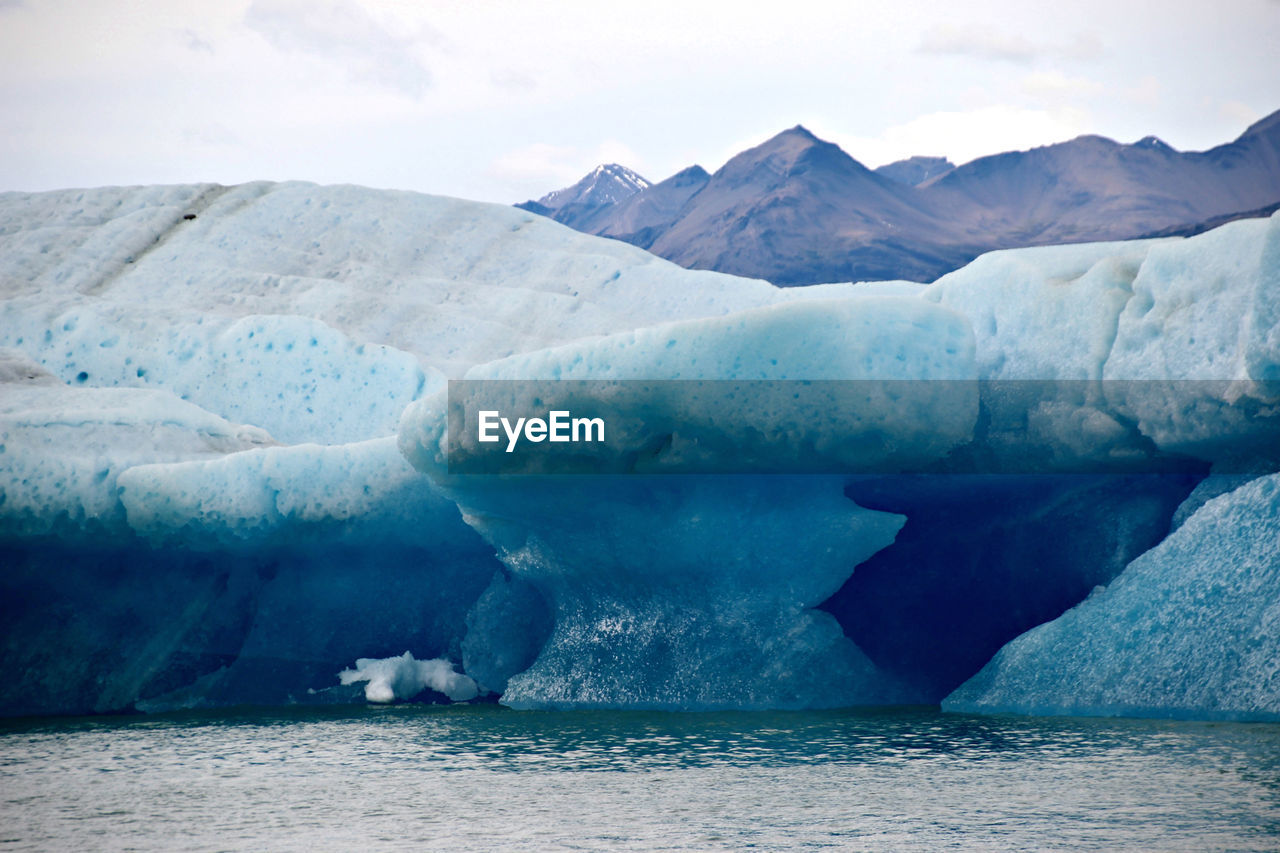 Scenic view of frozen lake against sky