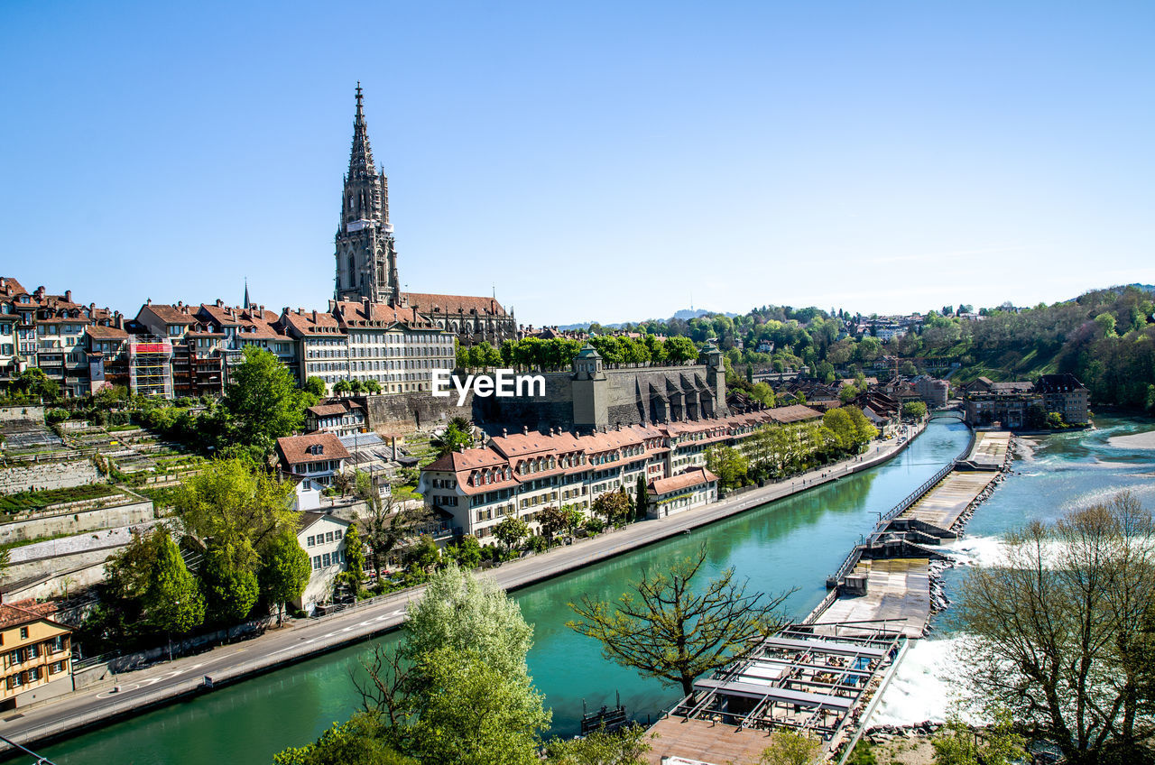 High angle view of bern minster by aare river against clear sky