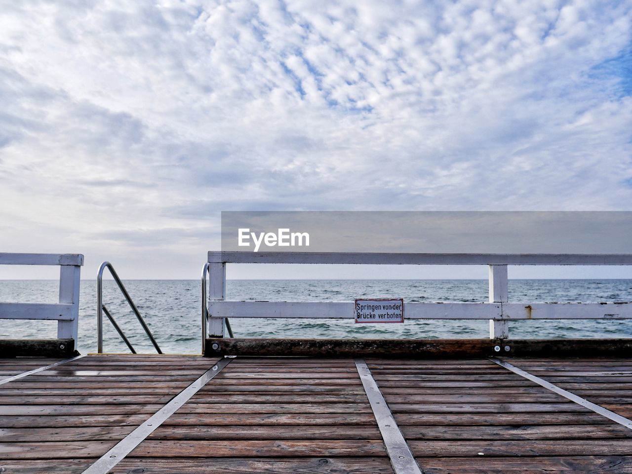 Pier over sea against sky