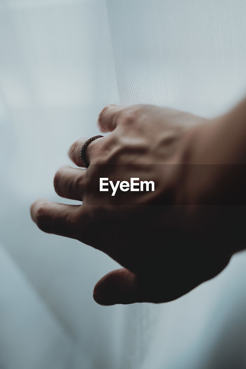 Close-up of hands against blurred background