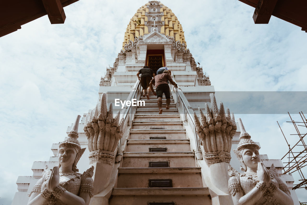 LOW ANGLE VIEW OF TEMPLE ON BUILDING