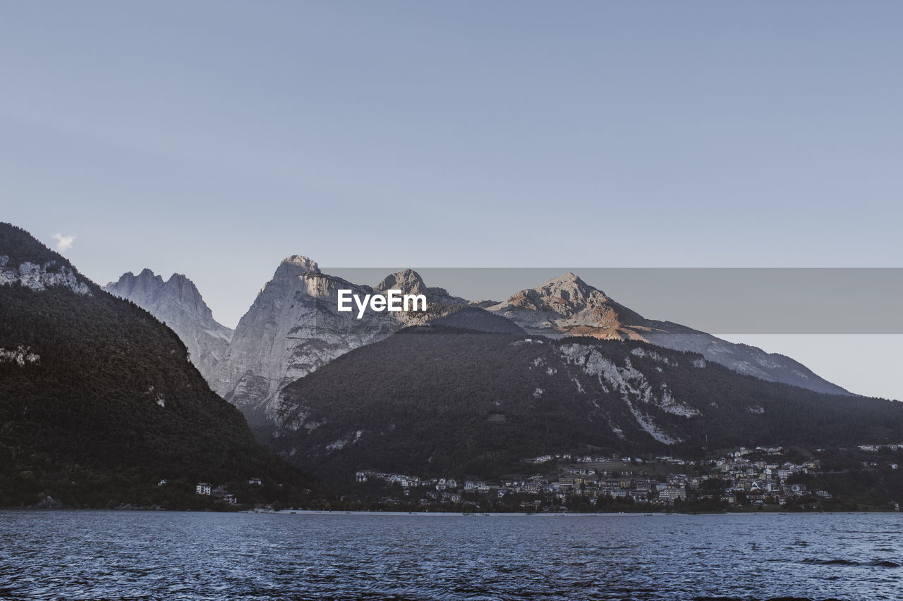 Scenic view of snowcapped mountains against clear sky