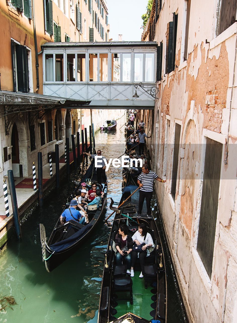 PEOPLE SITTING IN CANAL