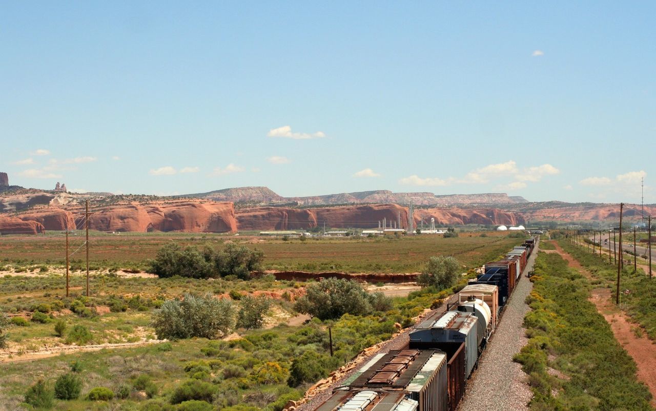 Freight train against mountains