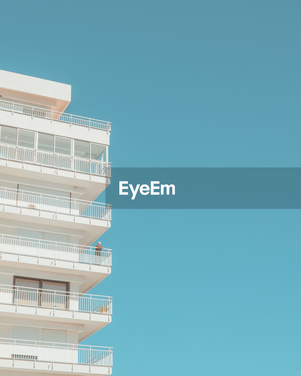 Low angle view of building against clear blue sky