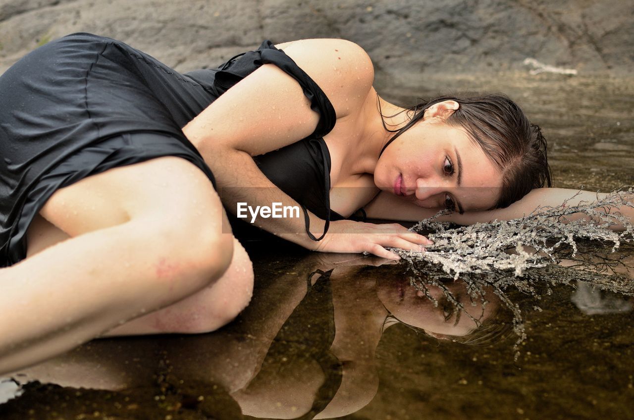 Woman lying on beach