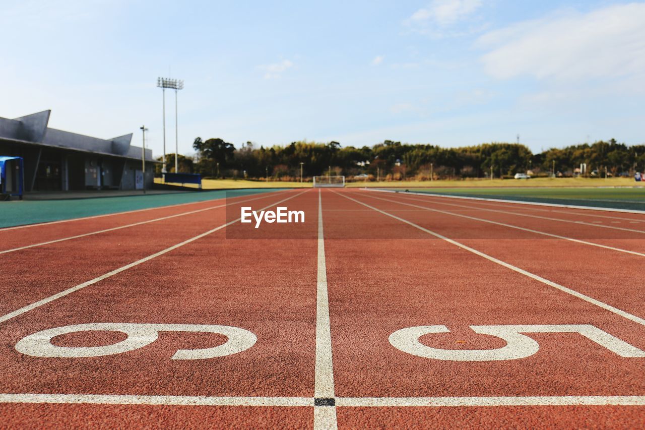 Number on running track against sky