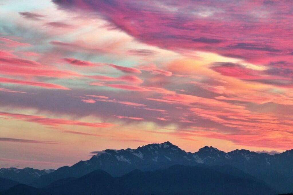 SCENIC VIEW OF MOUNTAINS AGAINST DRAMATIC SKY