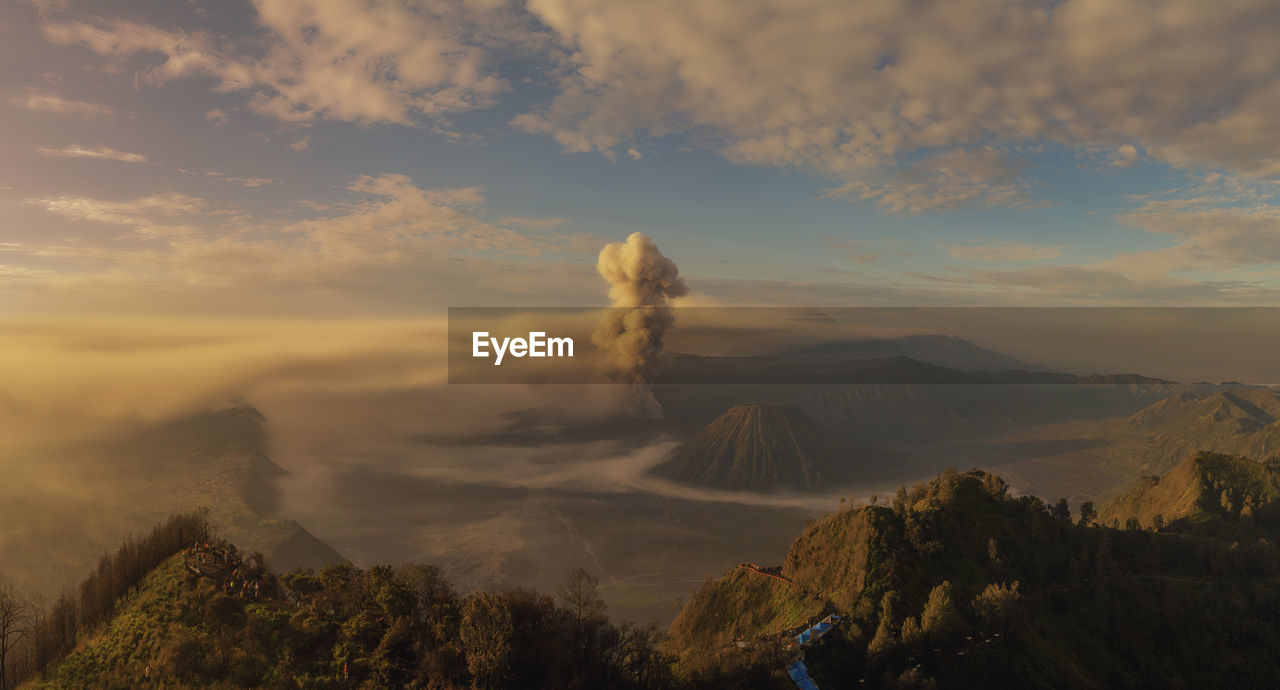Scenic view of volcanic landscape against sky during sunset