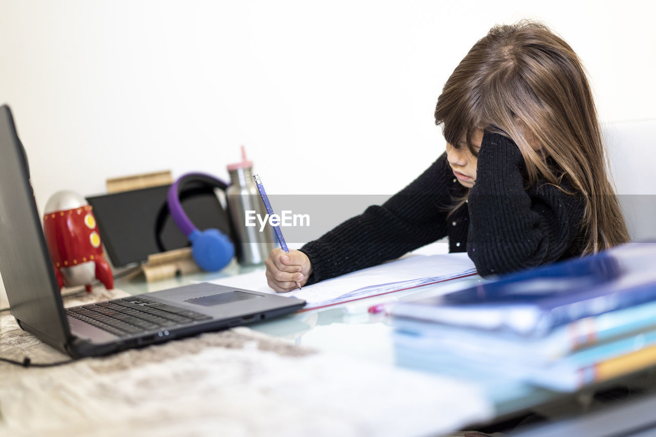 young woman using laptop at office