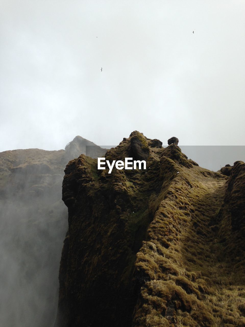 Rock formations on mountain against sky