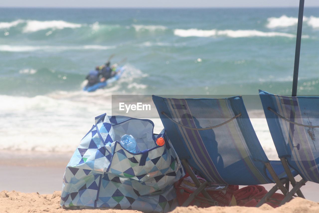 CLOSE-UP OF FLAGS AT BEACH