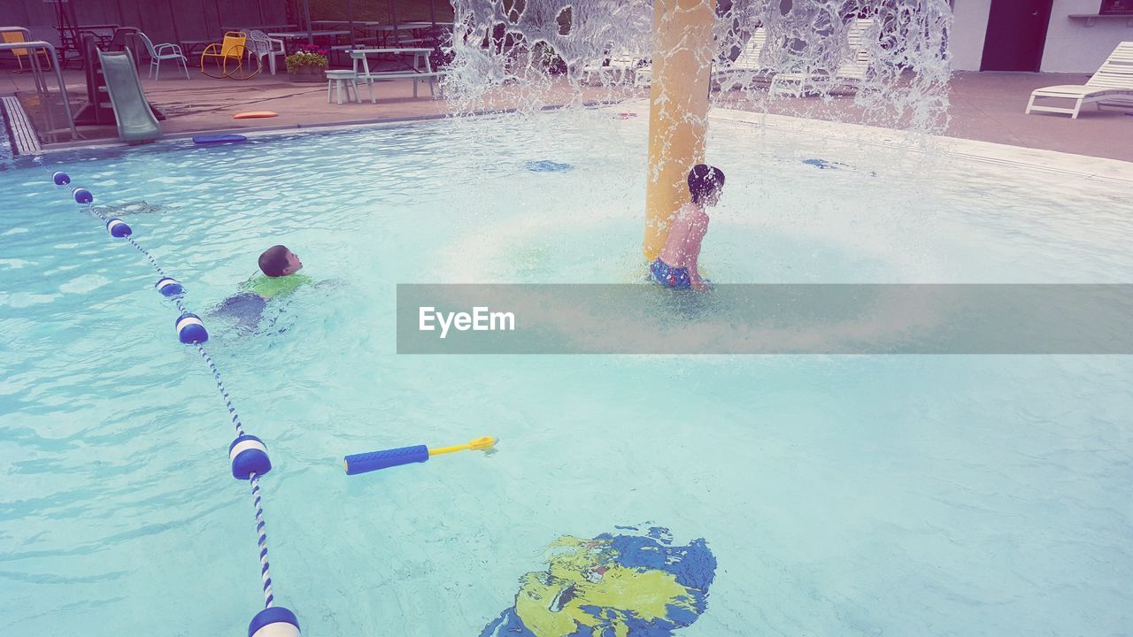 MAN PLAYING WITH SWIMMING POOL