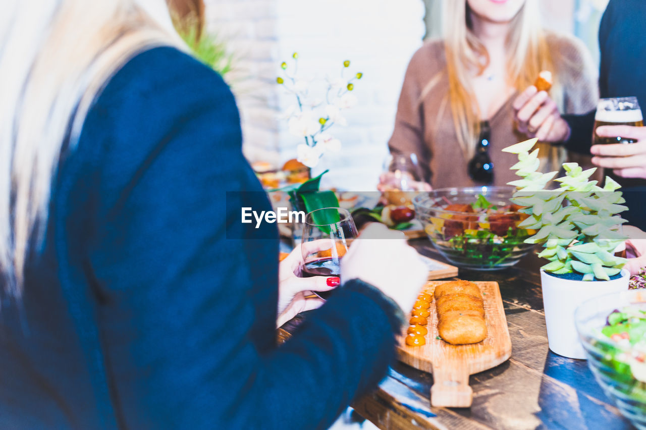 People having food on table at restaurant