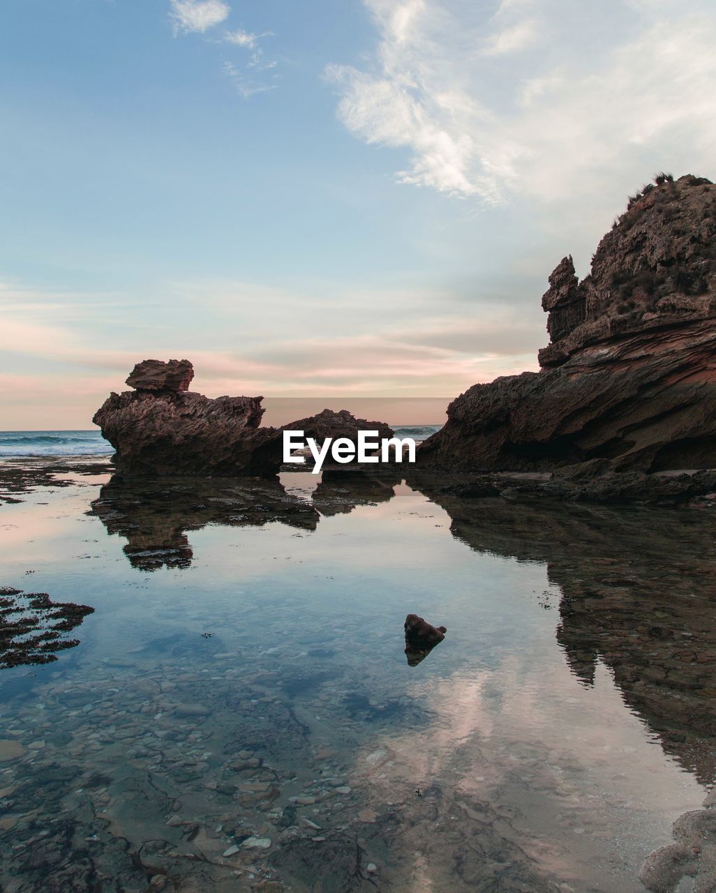 Scenic view of sea against sky at sunset