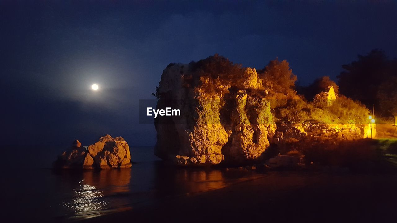 Panoramic view of sea against sky at night