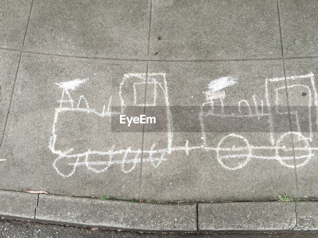 High angle view of train drawing on sidewalk