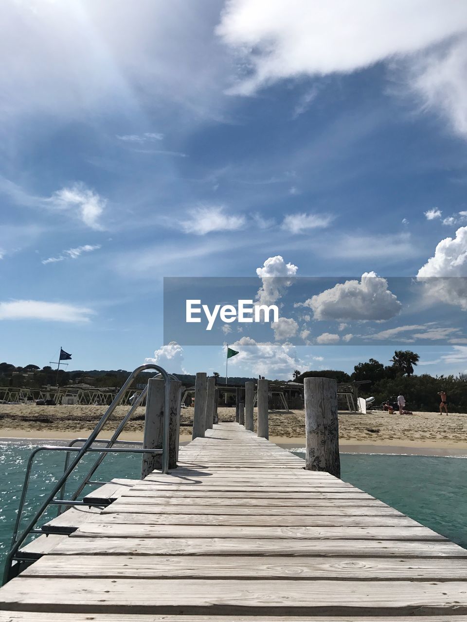 Pier over sea against sky