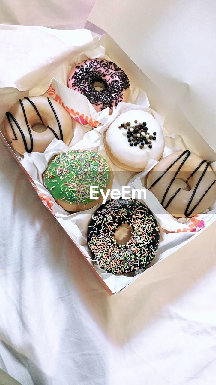 High angle view of donuts in box on table