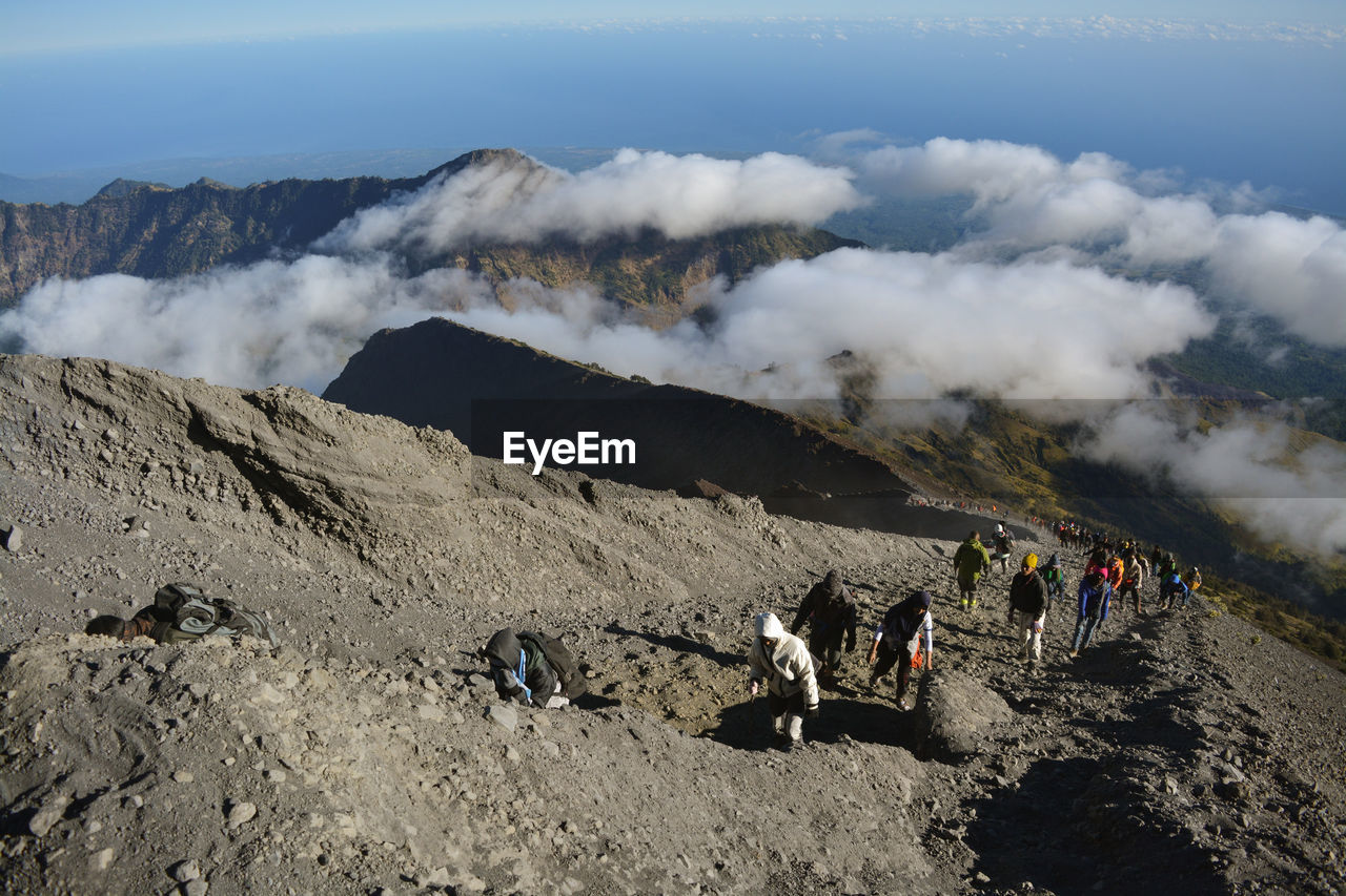 Group of people on volcanic mountain