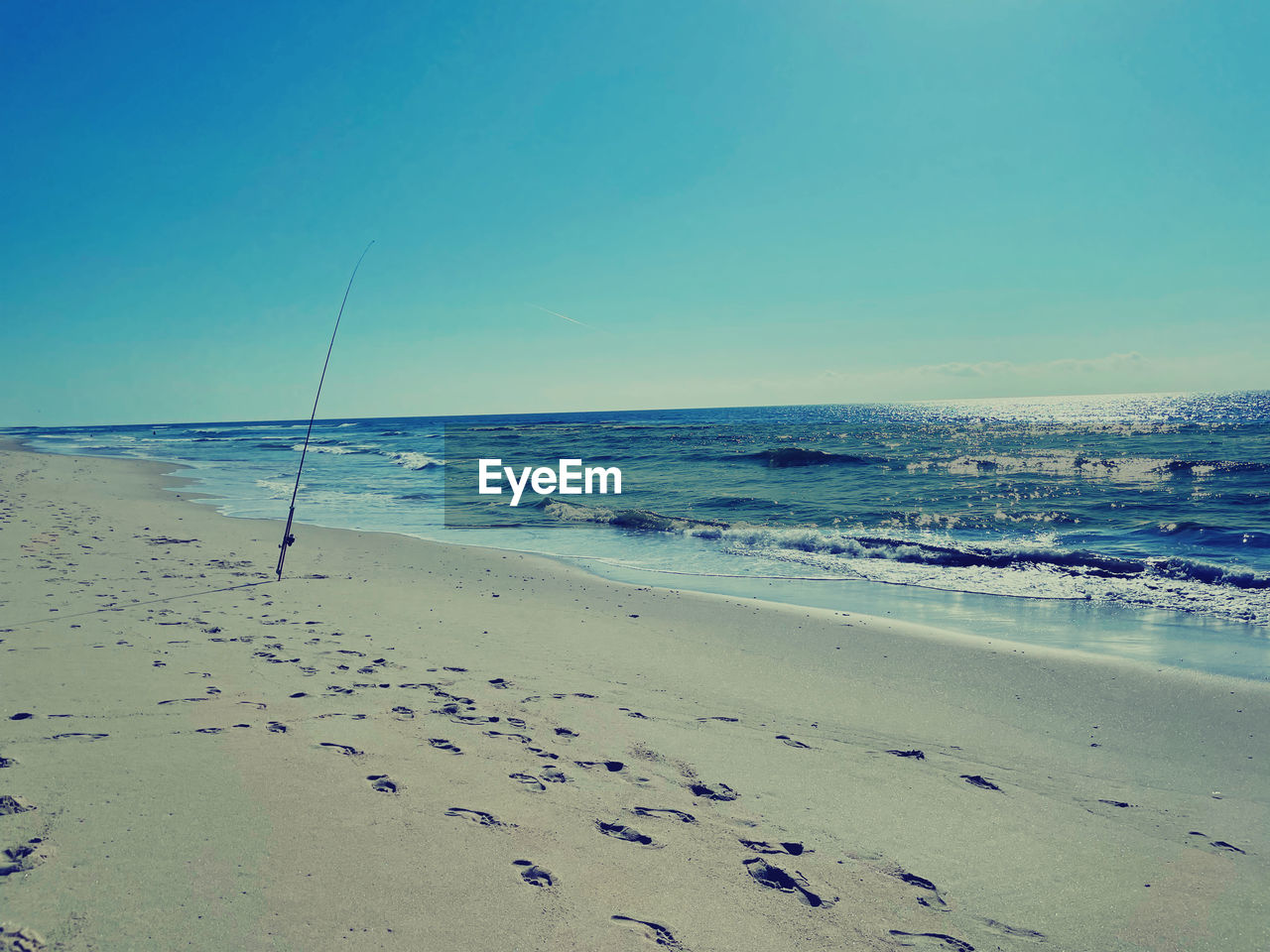 SCENIC VIEW OF BEACH AGAINST CLEAR SKY