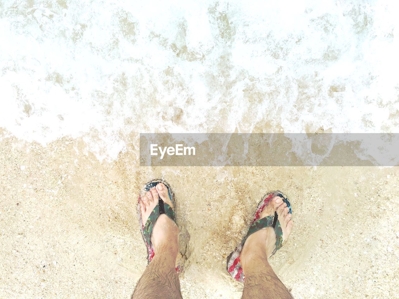 Low section of man at beach