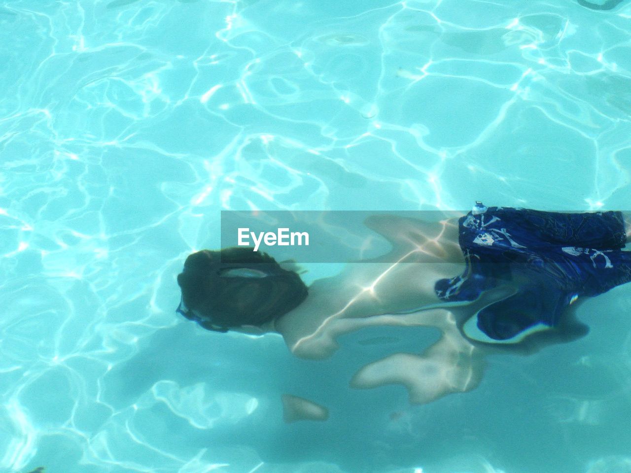 High angle view of man swimming in pool