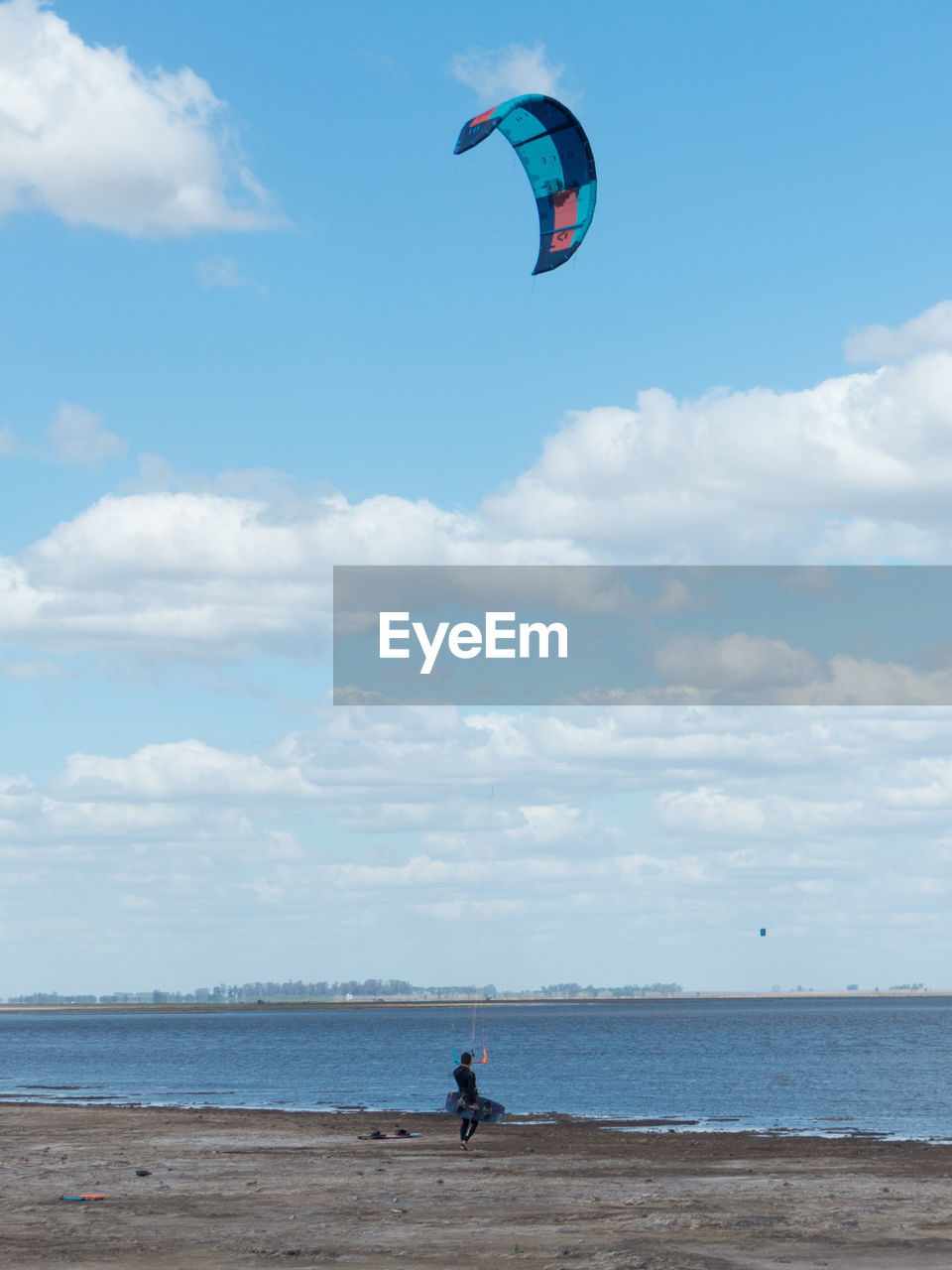 Beautiful landscape with kitesurfer