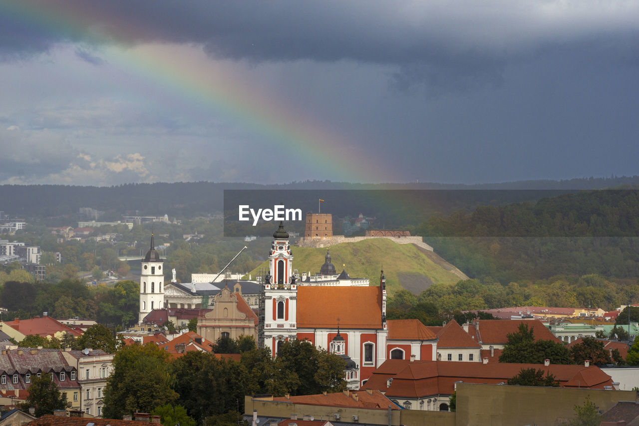 High angle view of the townscape against the rain in the sky