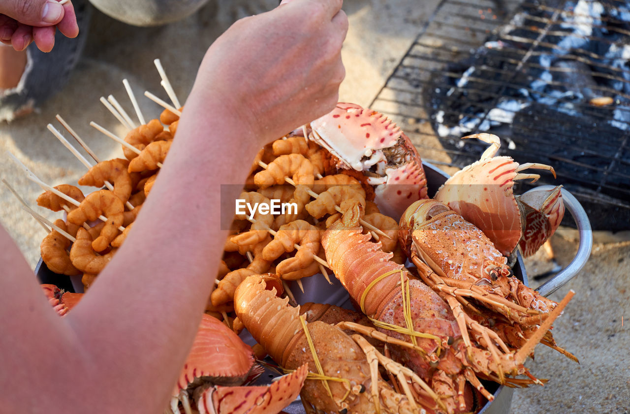 Close-up Day Food Food And Drink Freshness High Angle View Holding Human Body Part Human Hand Leisure Activity Lifestyles One Person Outdoors People Real People Seafood