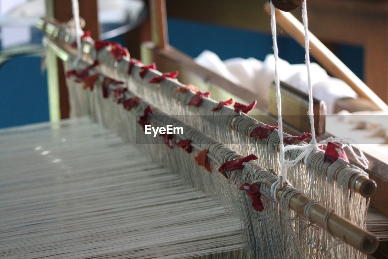 Threads on loom at factory